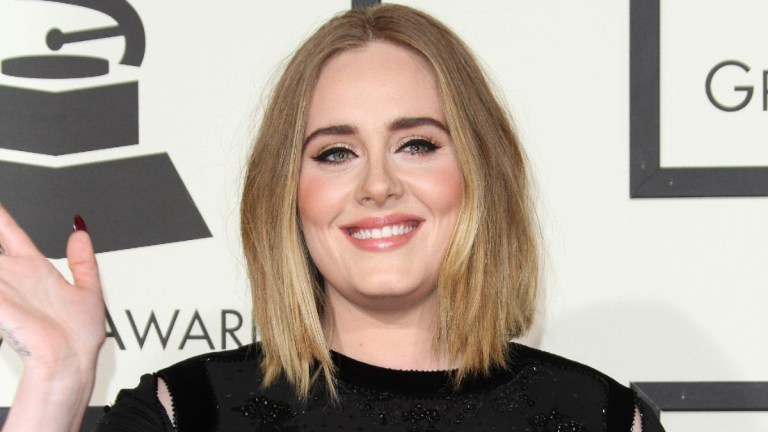 Adele poses for photos at the 58th Annual GRAMMY Awards